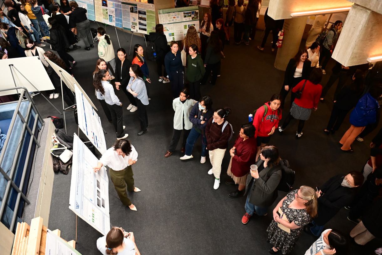 Overhead view of students and faculty walking through the Science Complex during the Ruhlman poster session.