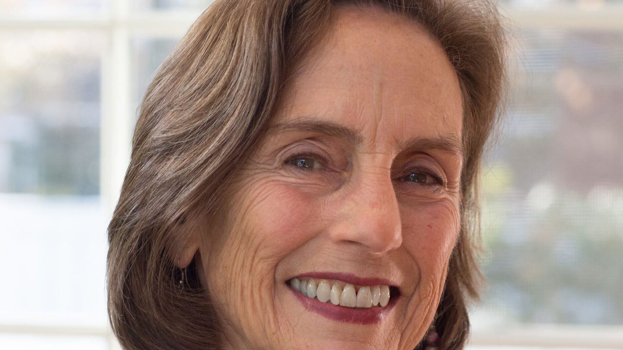 A headshot of a smiling woman looking at the camera.
