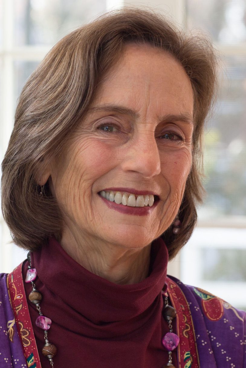 A headshot of a smiling woman looking at the camera.
