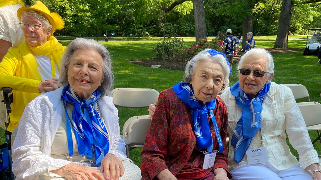 Three women from the class of 1949 sit together on Wellesley’s campus.