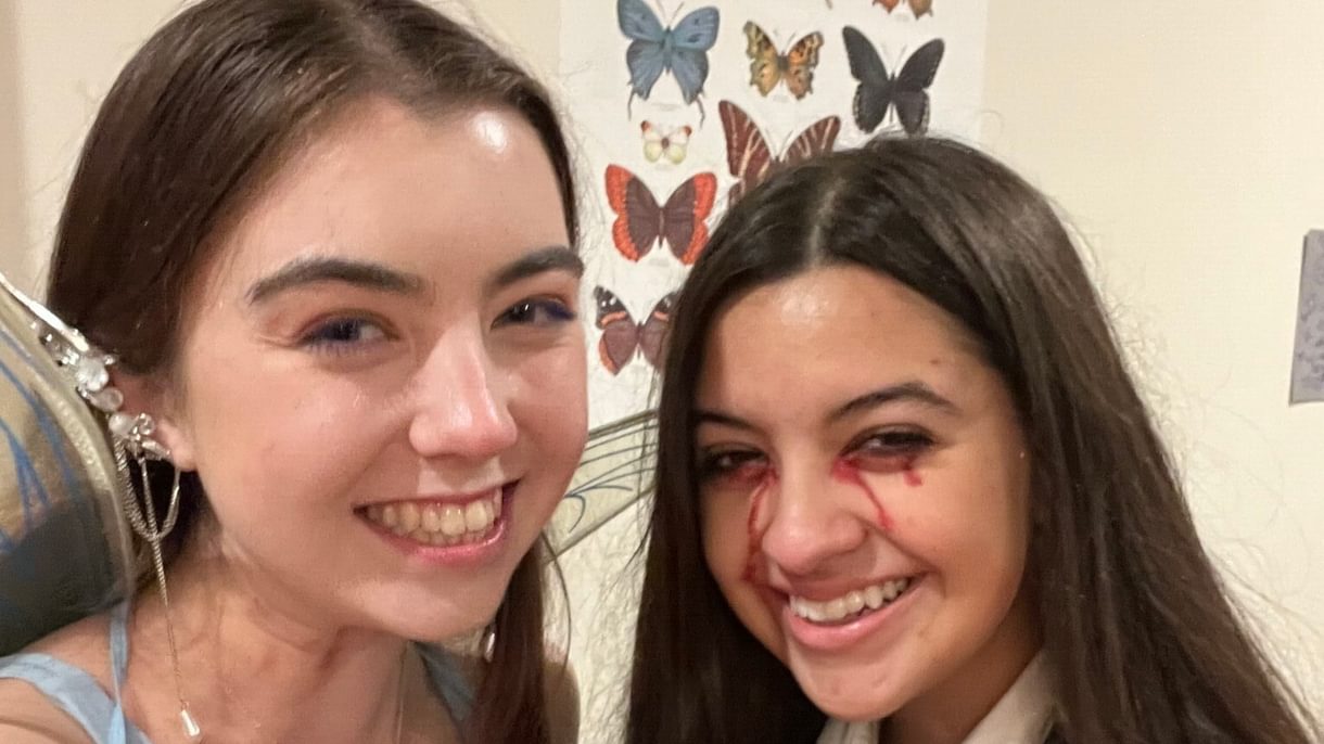 Two students dressed in Halloween costumes