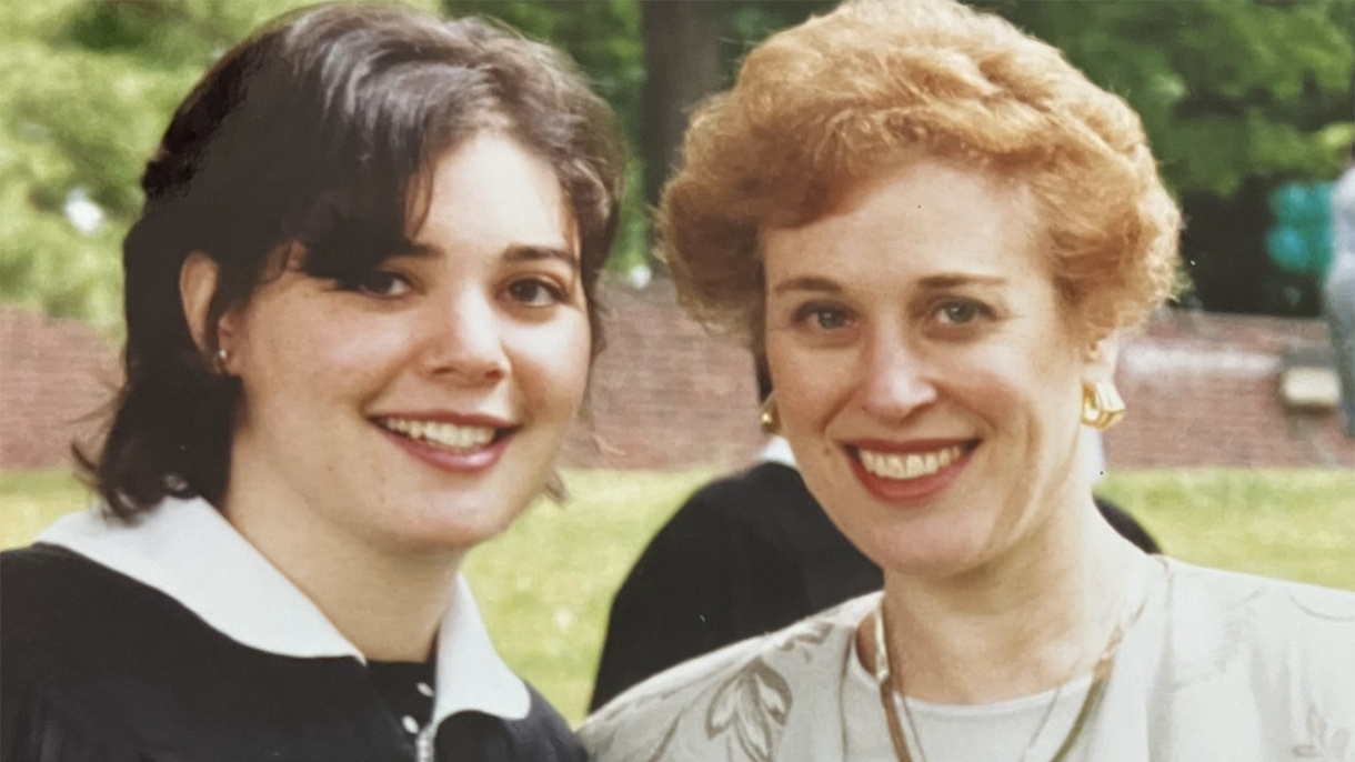 Lucy Brodman Lehman poses with one of her daughters for a photo at commencement.