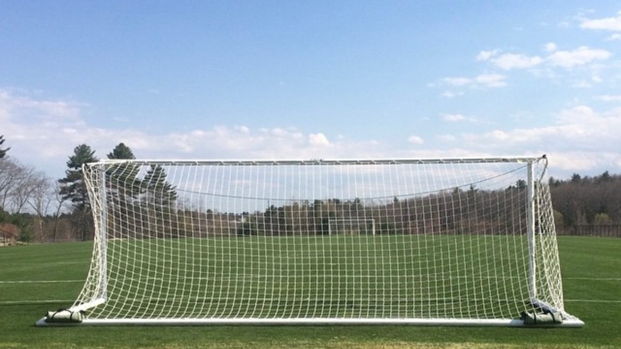 Soccer net on a soccer field.