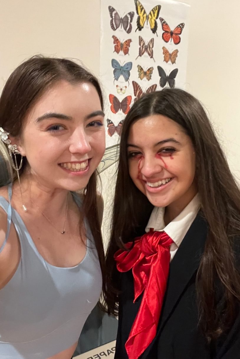 Two students dressed in Halloween costumes