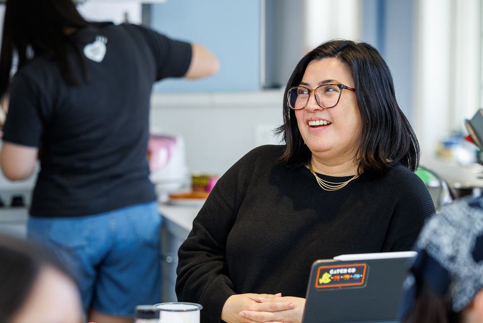 Genevieve Clutario stands at a countertop