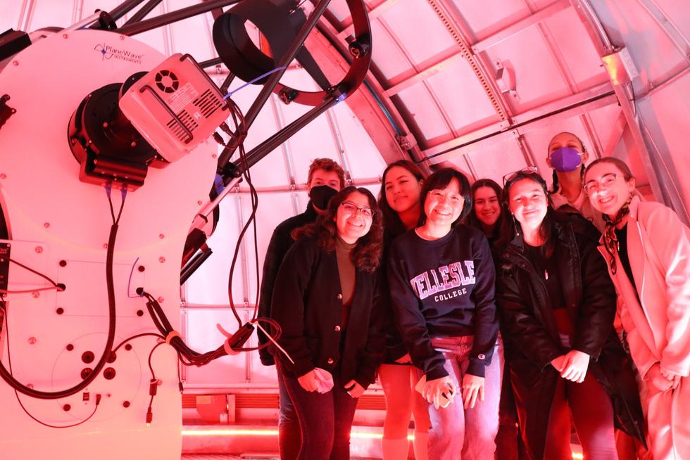 Group photo of students in the Whitin Observatory telescope room.