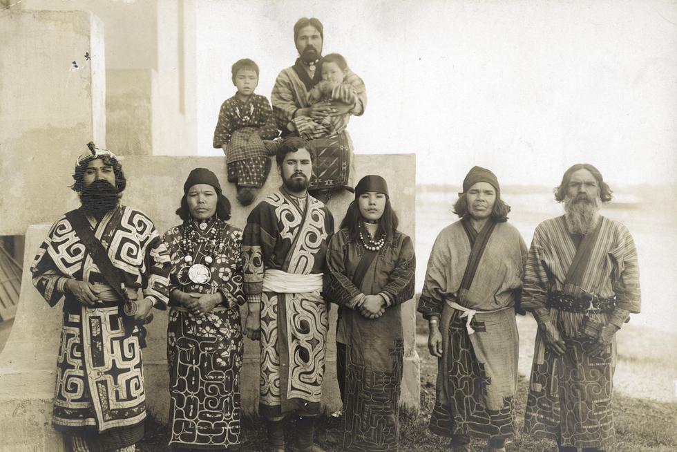 A black and white photo of a group of  indigenous Ainu people.
