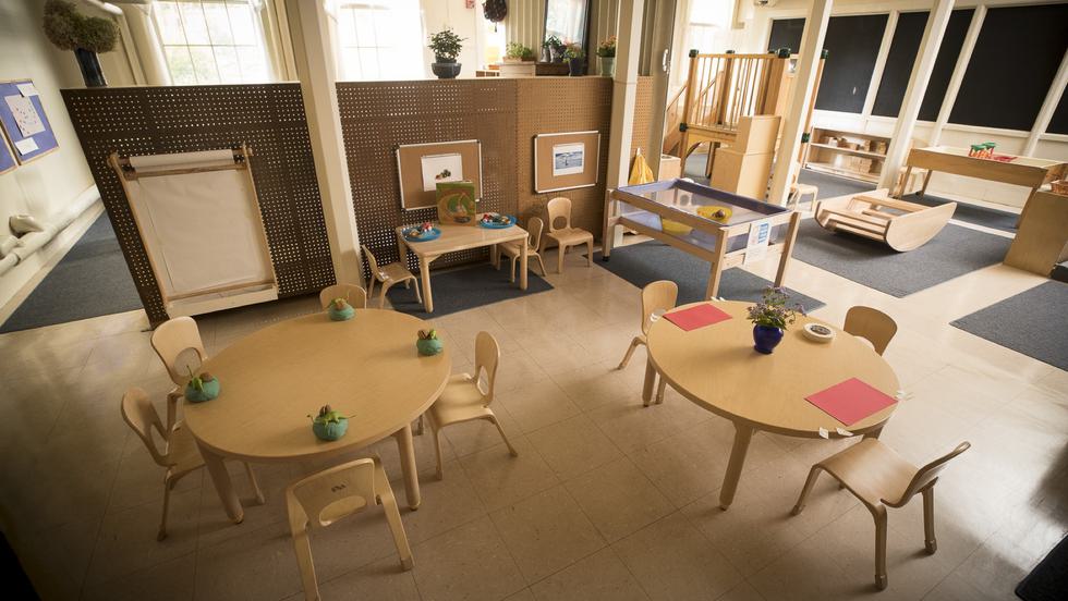 Small wooden tables and chairs with other indoor wooden playground equipment