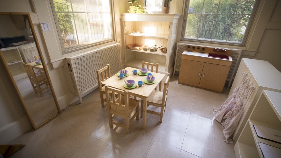 Wooden table, chairs, bookcase, and kitchen playset