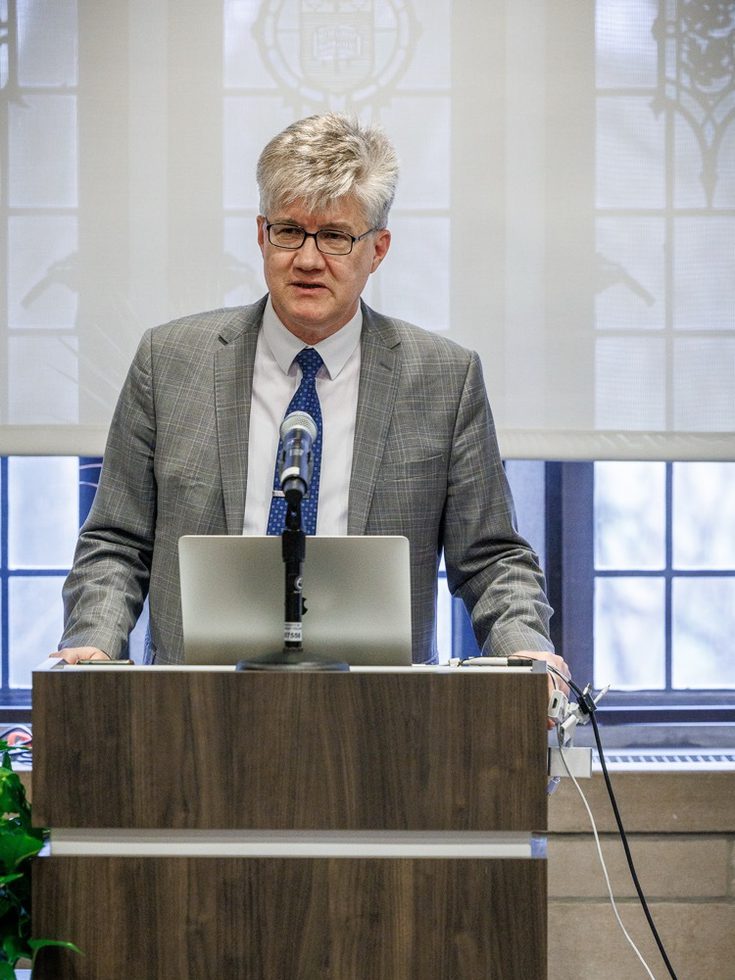 Ivan Kurilla speaking from a lecturn