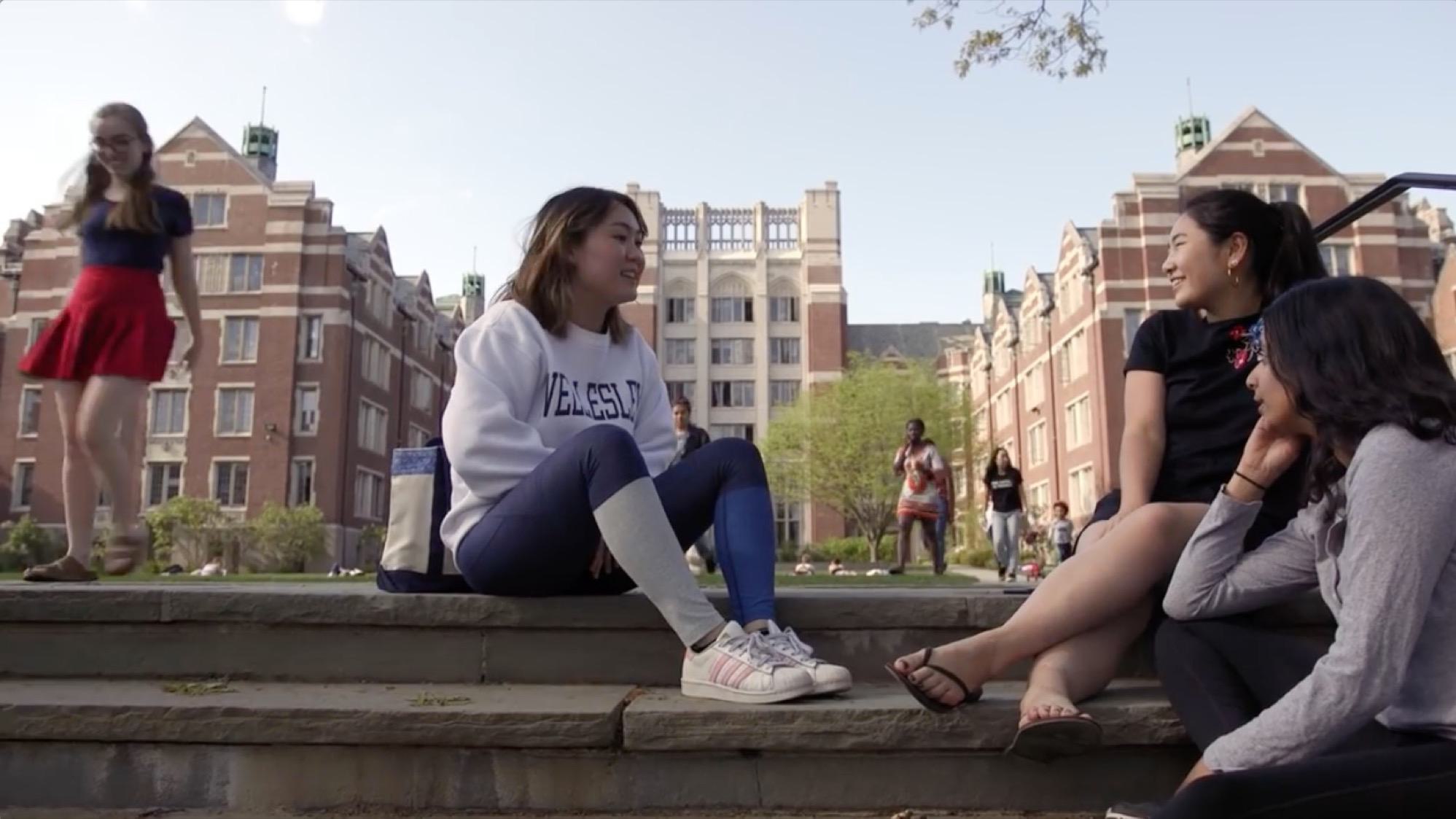 Students sitting on the steps in the courtyard leading up to Tower Court.