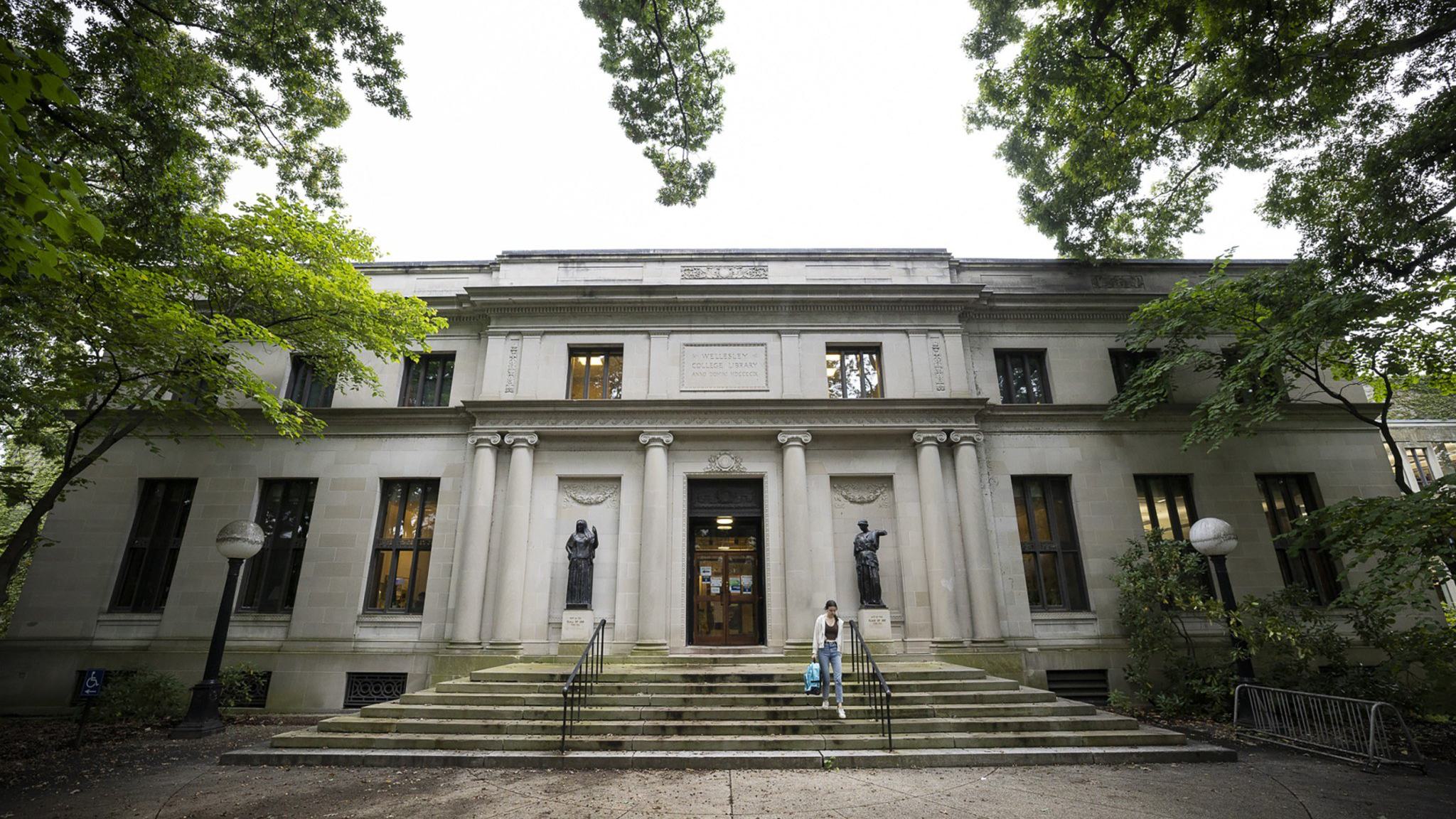Library steps with one student walking
