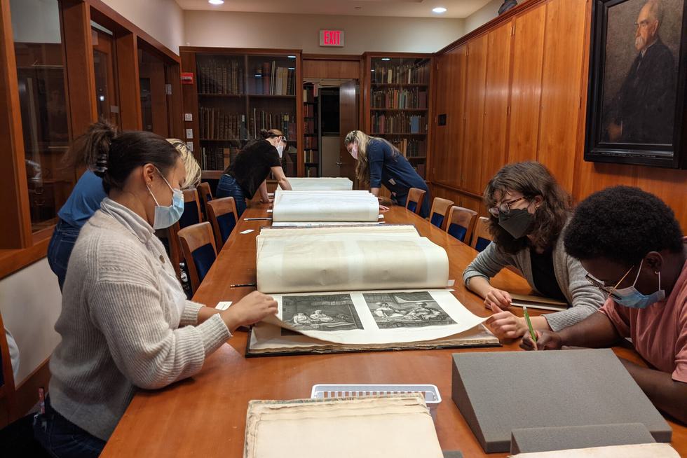Art History 312 students examine materials in Special Collections