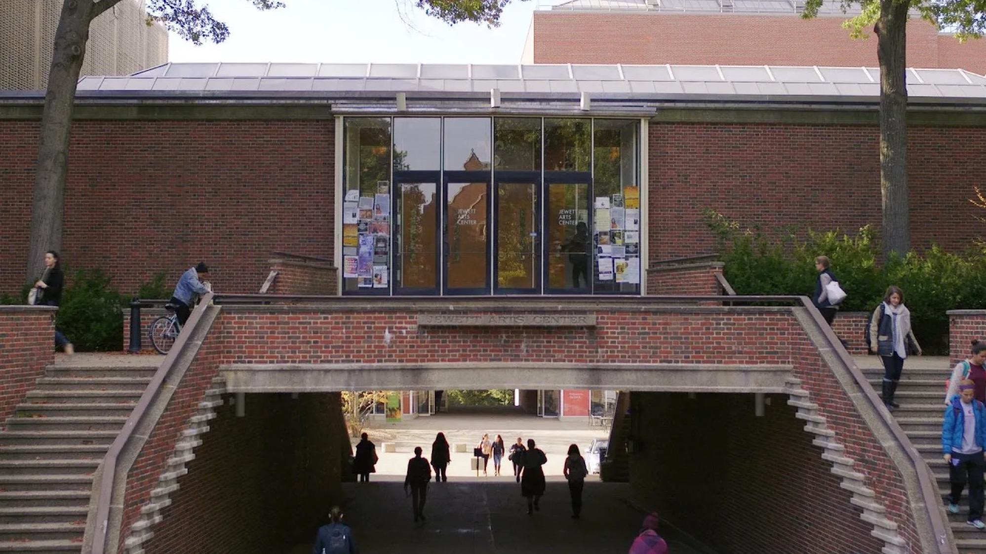 Still image of Jewett Arts Center at the start of a video titled "The Truth About Money"