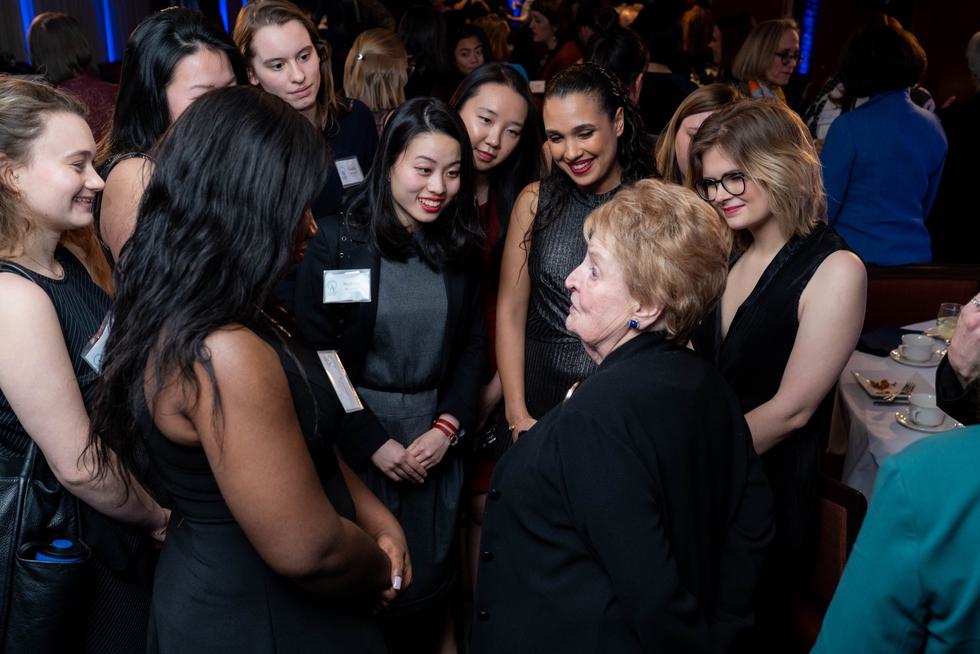 Madeleine Albright ’59 chats with a group of Albright Fellows.
