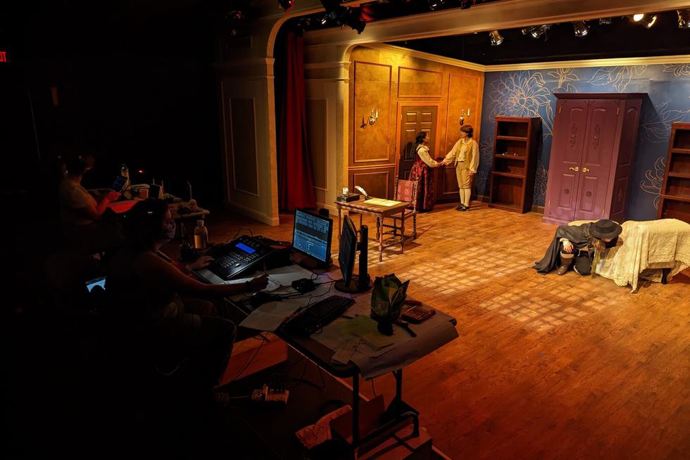 Students take part in a tech rehearsal for a play.