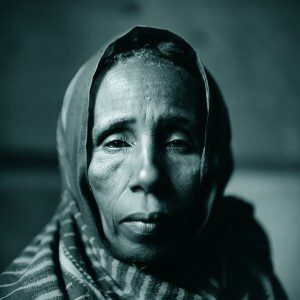 Toned gelatin silver print of a woman wearing head covering
