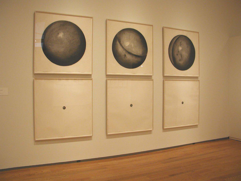 Installation featuring six frames of three large and three small circle drawings