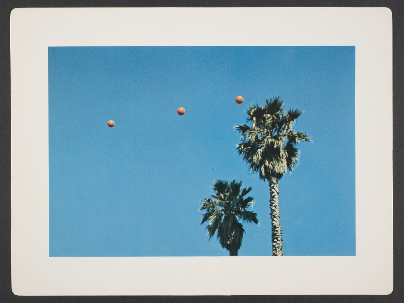 John Baldessari, Throwing Three Balls in the Air to Get a Straight Line (Best of Thirty-Six Attempts), sheet from artist book consisting of folio cover and fourteen leaves, 1973. 9 5/8 in. x 12 3/4 in. (24.4 cm x 32.4 cm). Museum purchase, The Nancy Gray Sherrill, Class of 1954, Acquisition Fund. 2007.161 © John Baldessari