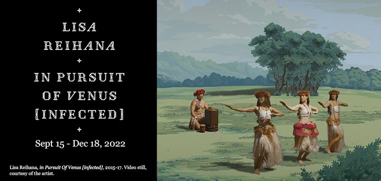 Three women in garlands and grass skirts dance to drum music