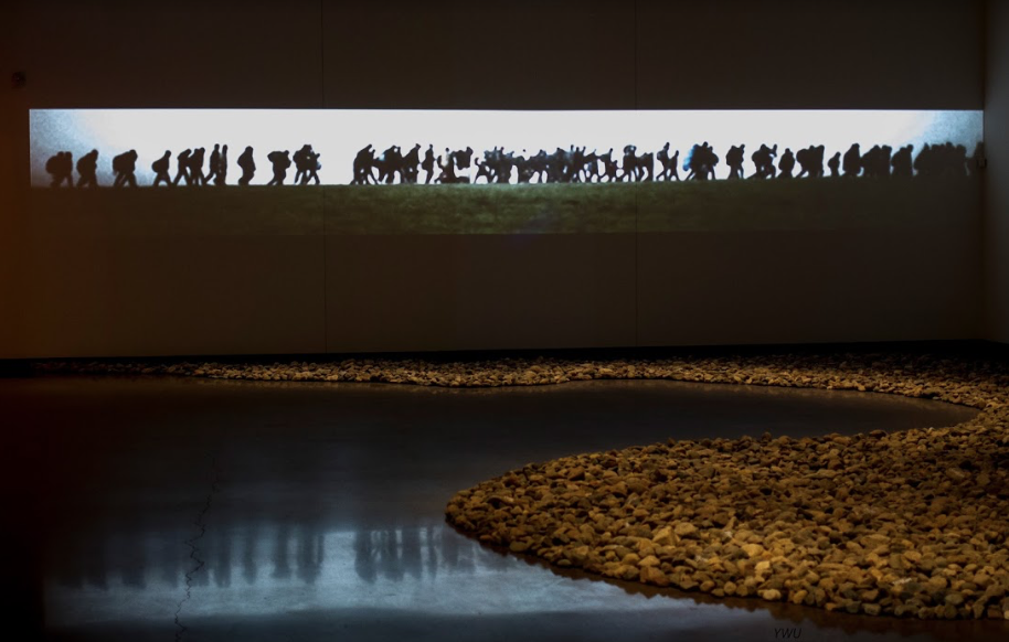 Art instillation made with HD video and 6 tons of field rocks