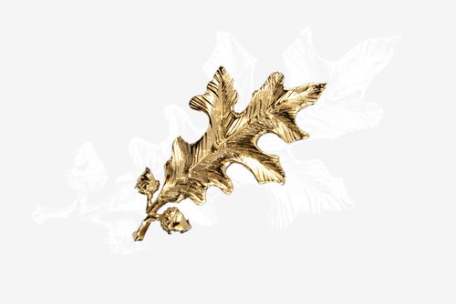 a gold-tone oak leaf and acorn motif