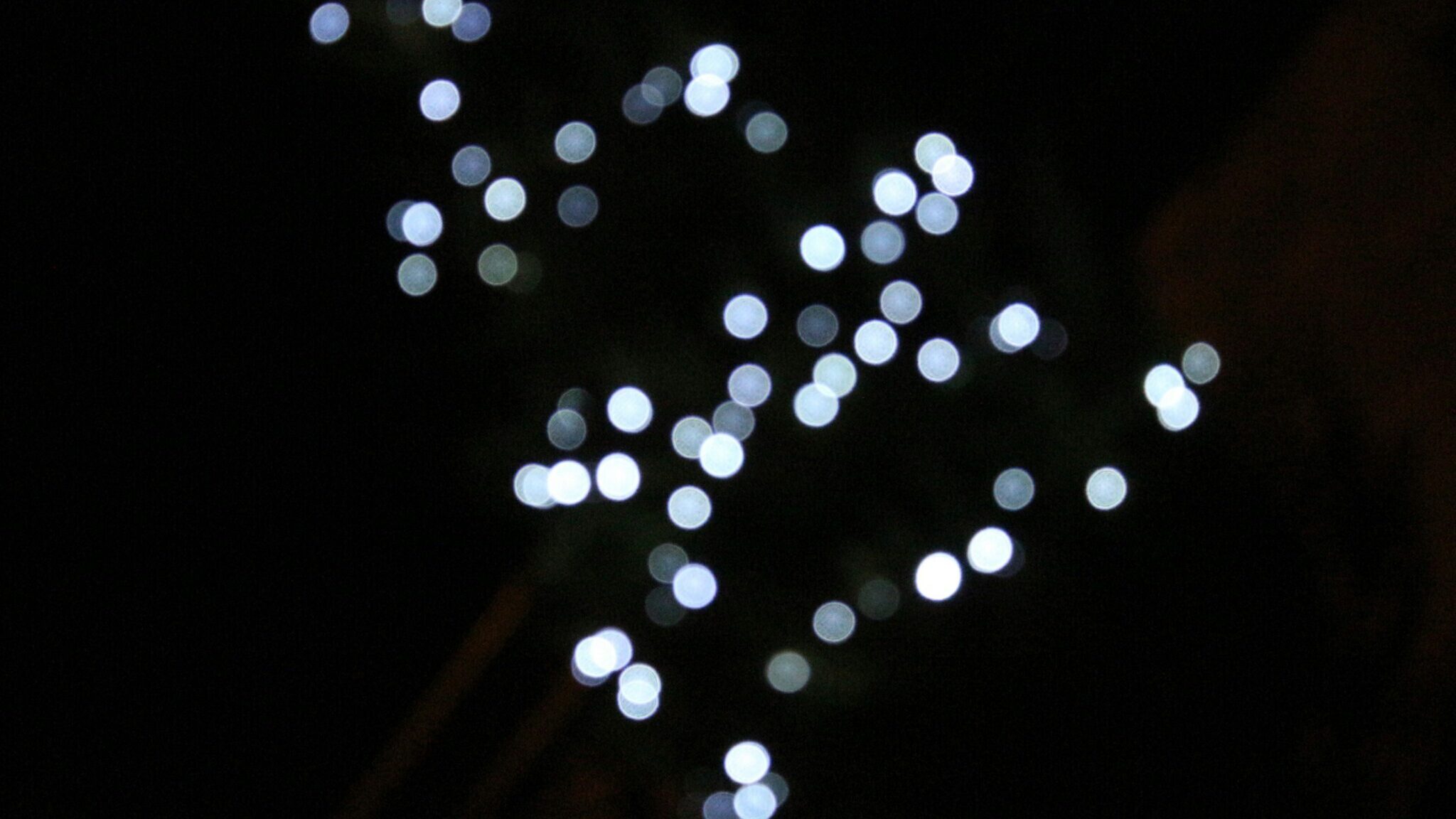 Blurred, circular lights against a dark background