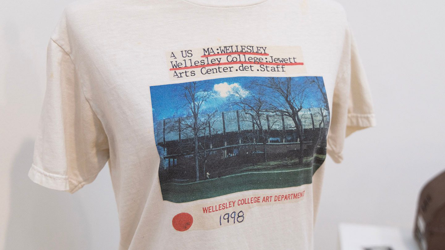 white t-shirt with printed photo of Jewett Arts Center and slide text
