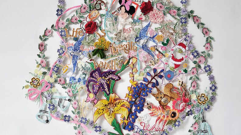 Object consisting of colorful, artfully arranged scraps of embroidery and needlework