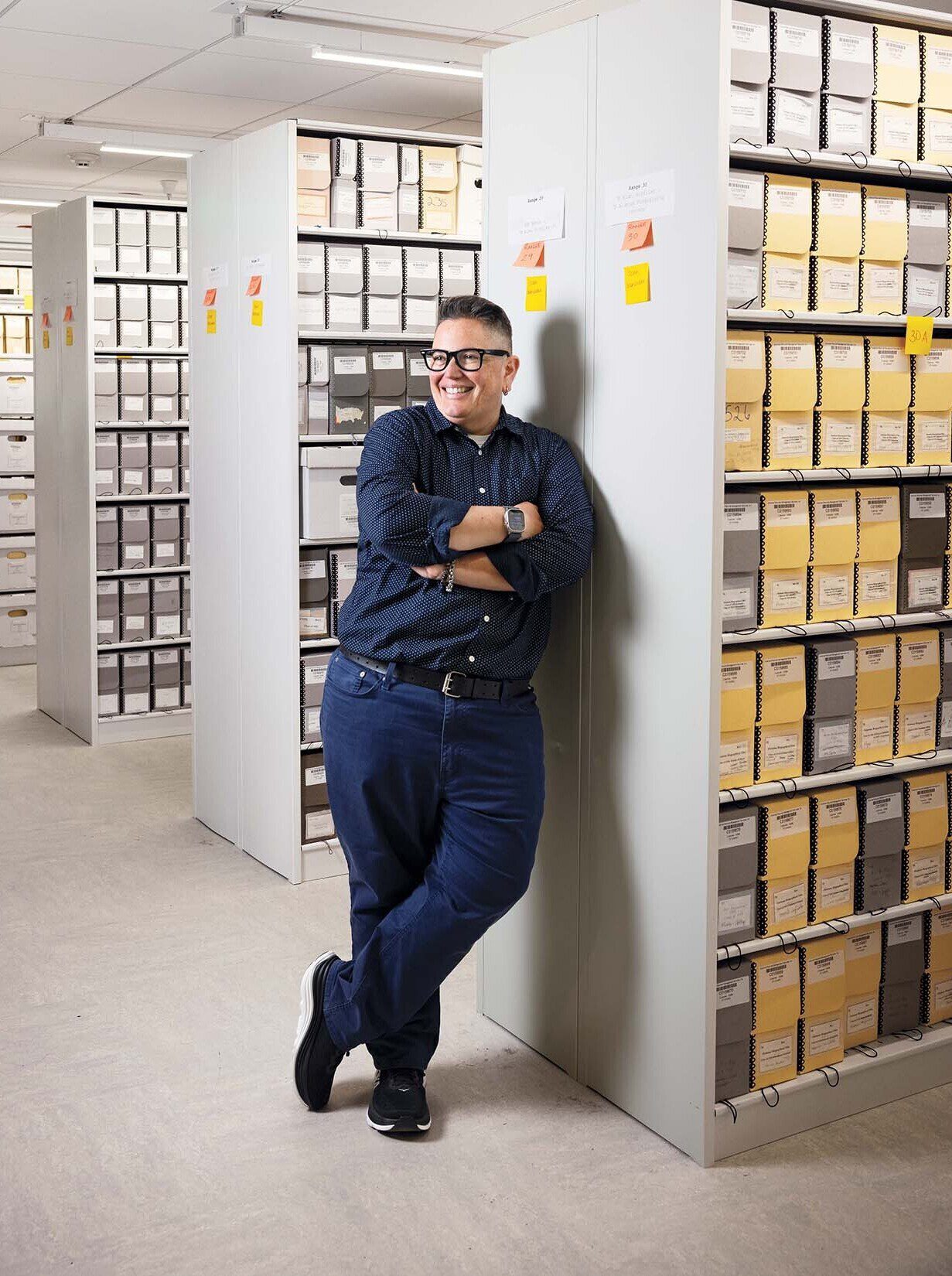 Sara Ludovissy, College archivist, with some of the collection. (Photo by Adam DeTour)