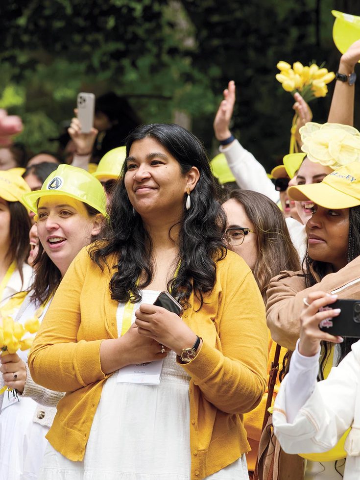 Members of the yellow class of 2015 cheer at the alumnae parade