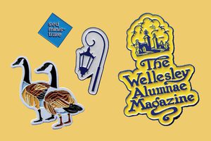 Photo of four pins: One stating "sed ministrare", one of a Wellesley lamppost, one of an old timey cover of Wellesley Alumnae Magazine, and one of two Canada geese