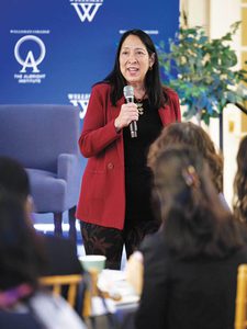 Photo of Michele Sison speaking into a microphone