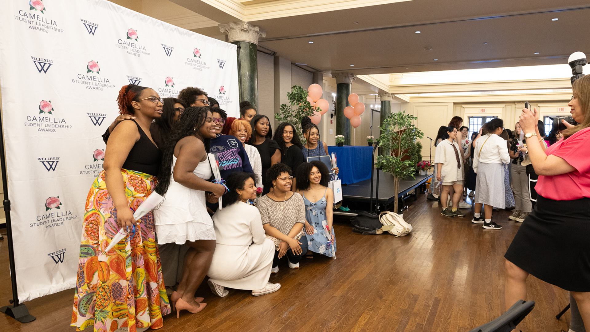 A group of students pose for a photo during the reception of the ceremony.