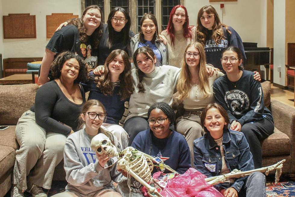Claflin House Council pose with Kulima, a plastic skeleton that serves as Claflin’s unofficial mascot.