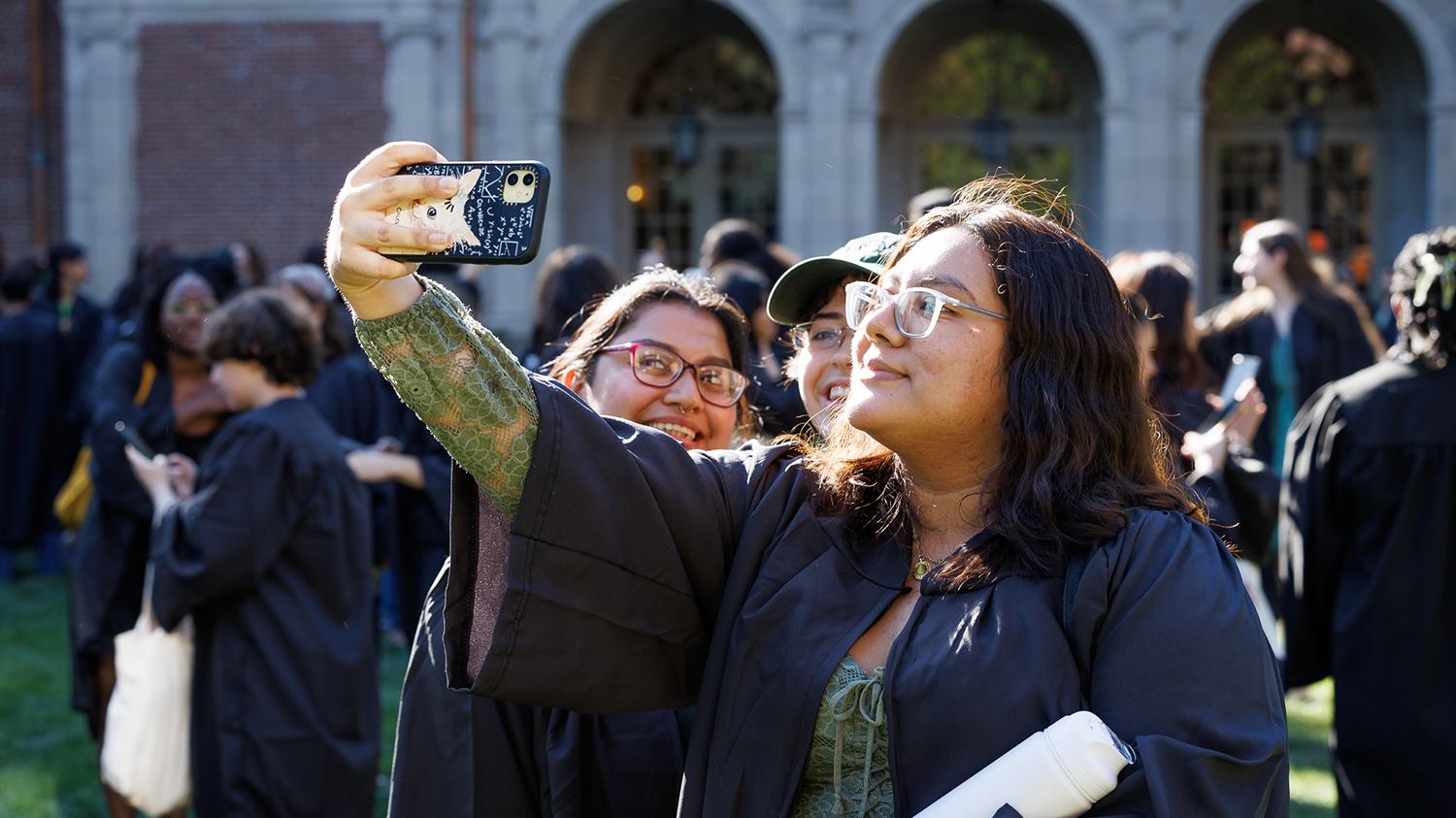 Students pose for a selfie ahead of convocation.