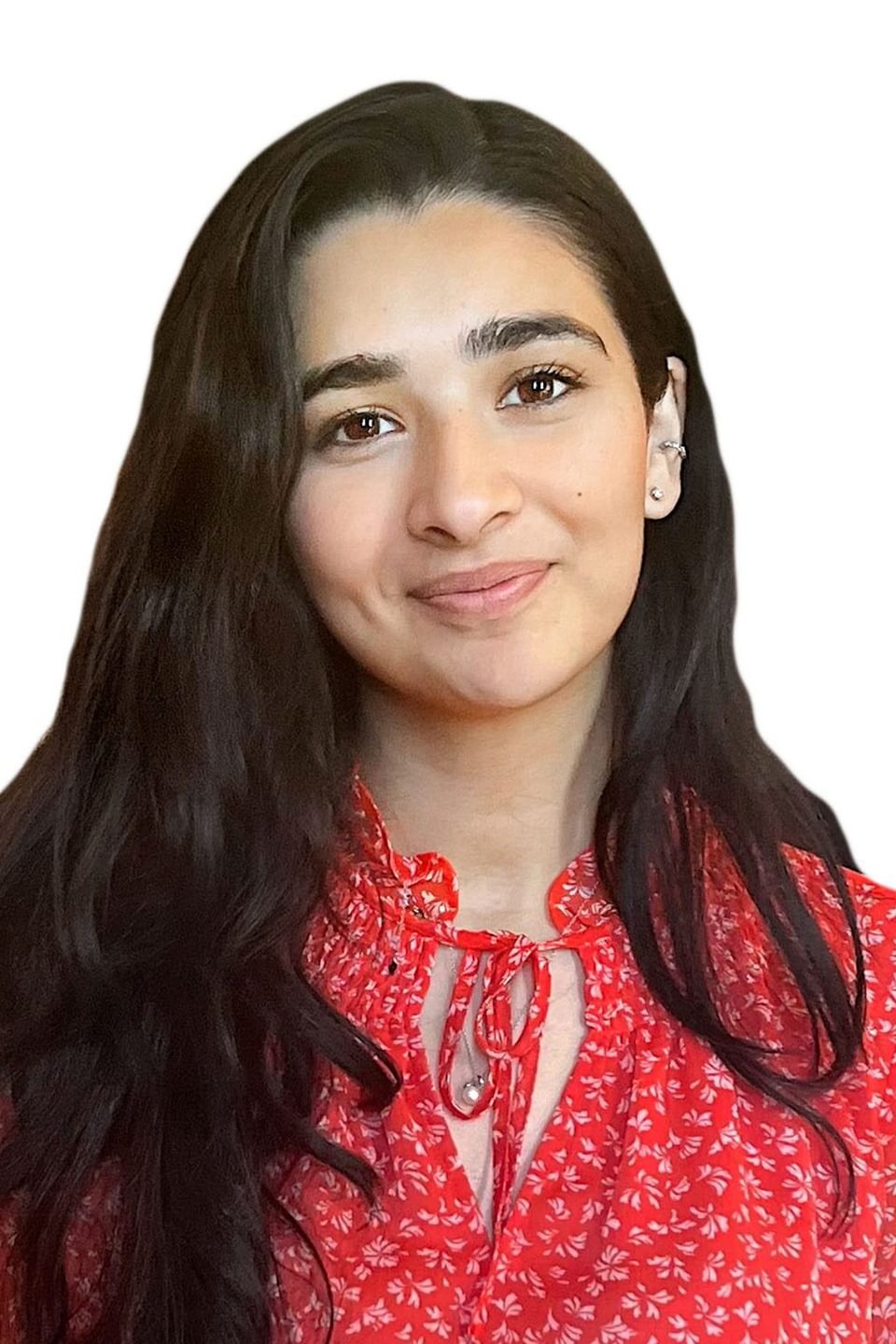 Headshot of Eshika Kaul against a white background. She wears a red top and has long dark hair