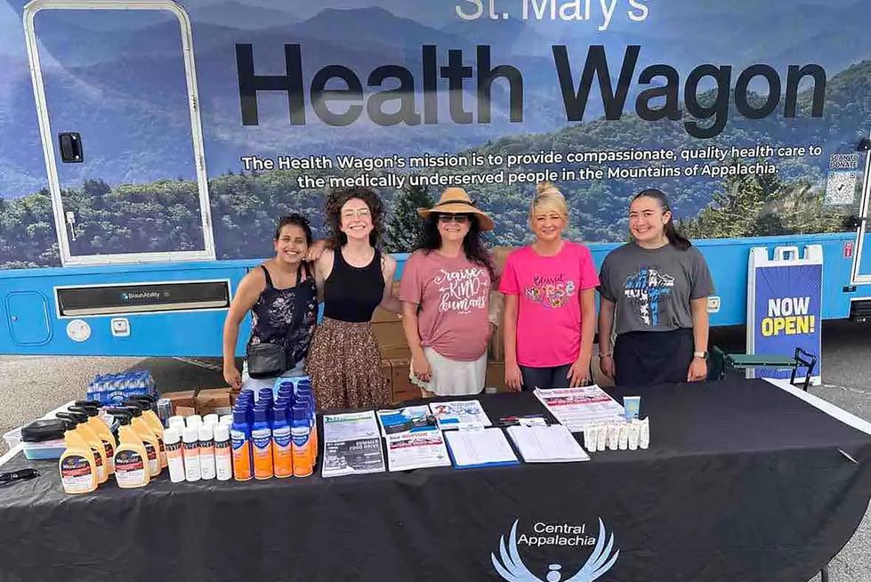 Students interns and staff of the Health Wagon pose in front of the winnebago.