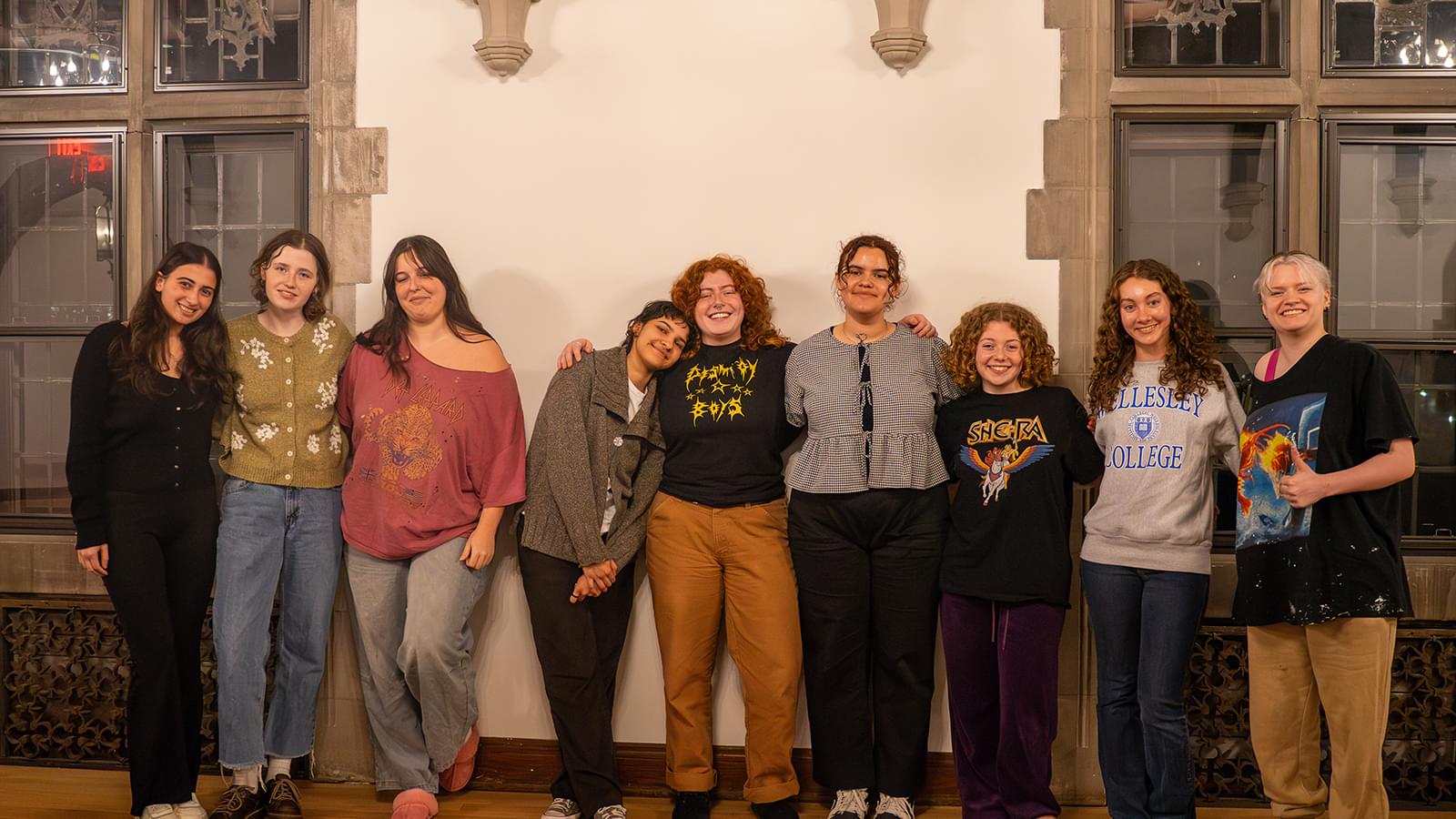 Members of Severance House Council stand against a wall and pose for a group photo.