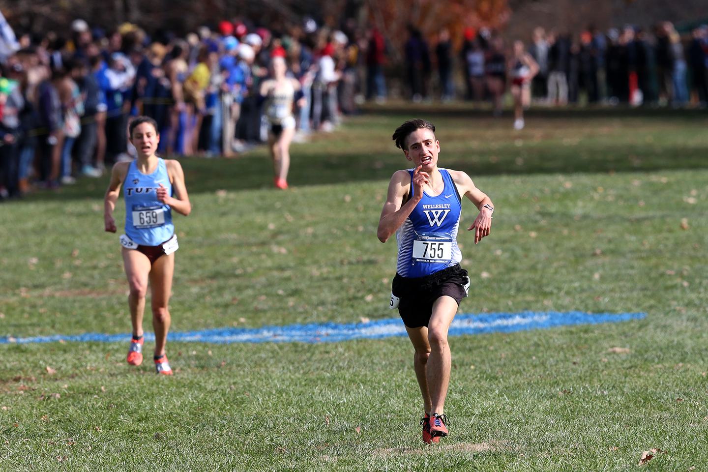 Senior Ari Marks sprints toward the finish line during a cross country competition.