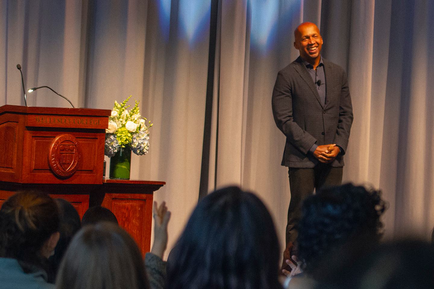 Civil Rights Lawyer Bryan Stevenson smiles while receiving a standing ovation.