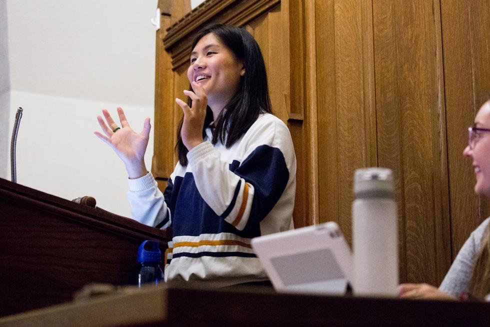 Diana Lam speaks from a podium.
