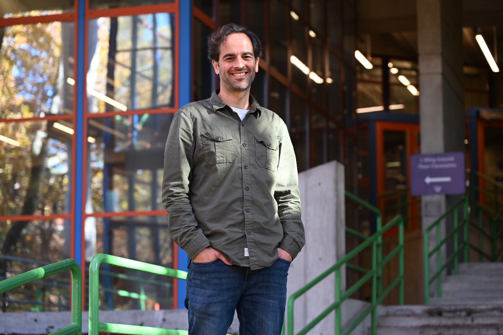 James Battat stands outside the Science Complex