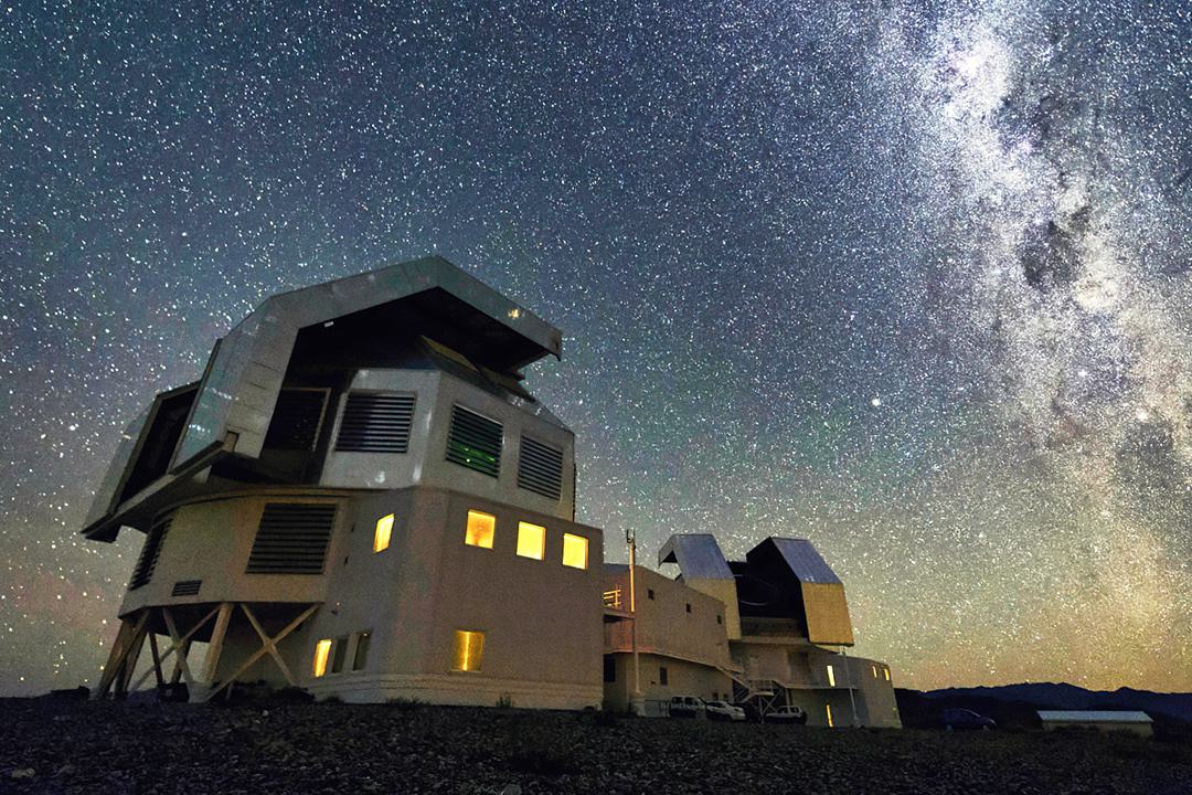 Las Campanas Observatory set against an extremely starry night sky
