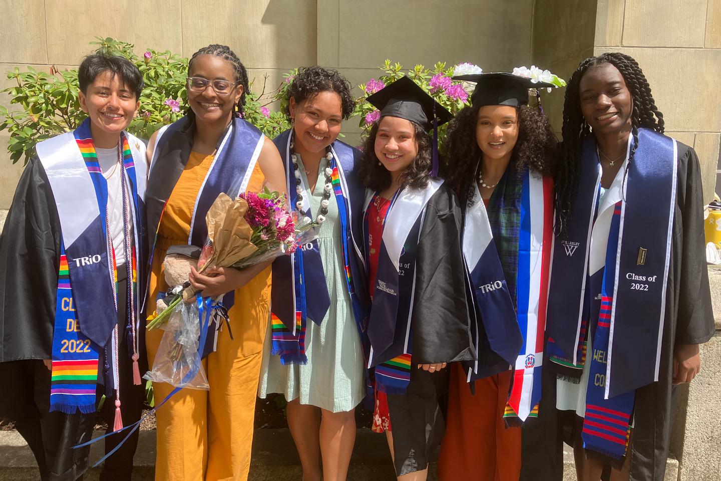 Six Wellesley 2022 graduates who were also McNair scholars pose together for a photograph.