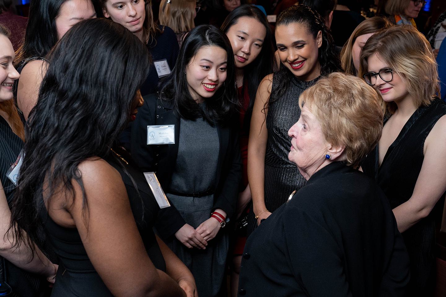Madeleine K. Albright ’59 MKA surrounded by 2020 Albright Fellows during the closing dinner dialogue.