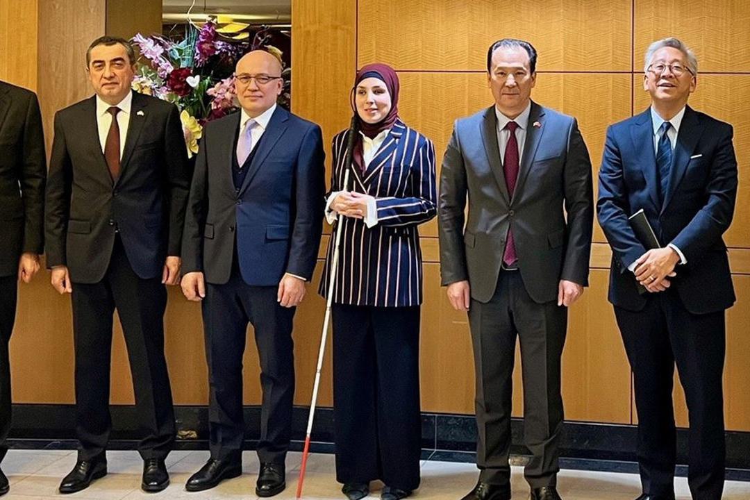 Sara Minkara, U.S. Special Advisor on International Disability Rights stands with ambassadors from C5 countries.