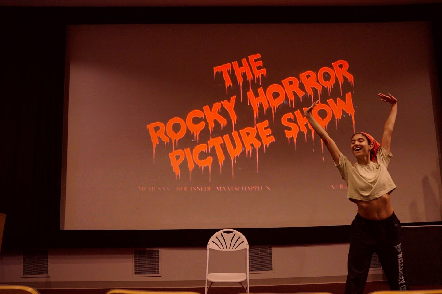 A student dances onstage at Wellesley's October 2022 shadowcast production of Rocky Horror Picture Show.