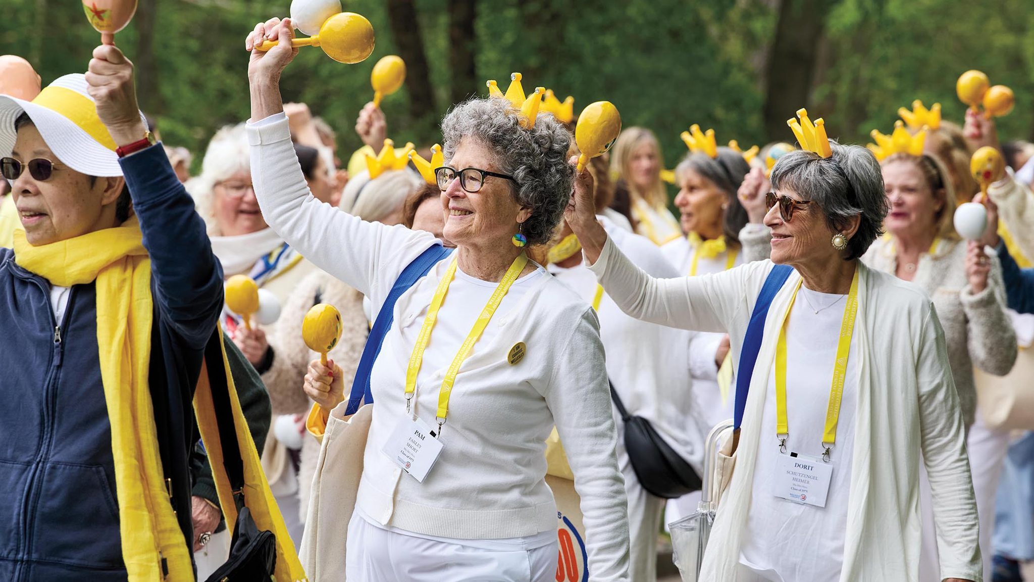 Members of the class of 1975 wave in the alumnae parade