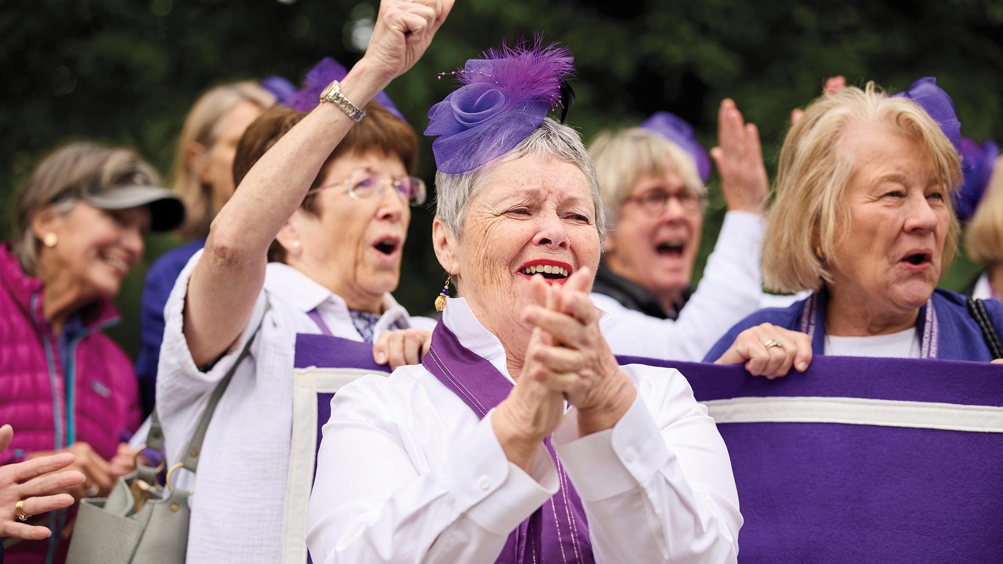 Members of the purple class of 1970 cheer in the alumnae parade